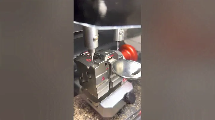 Black Widow key cutting machine.  Decoding key by picture then cutting it on the machine.